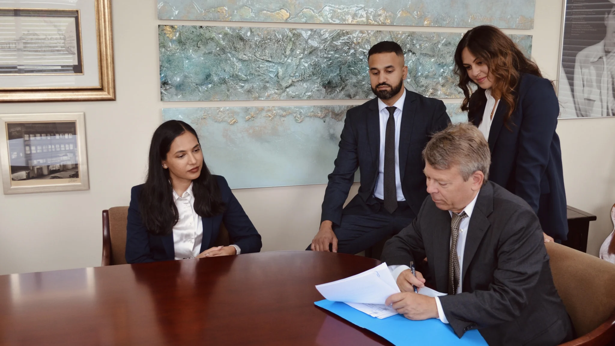 Fleetwood Family Law team reviewing case documents around a conference table